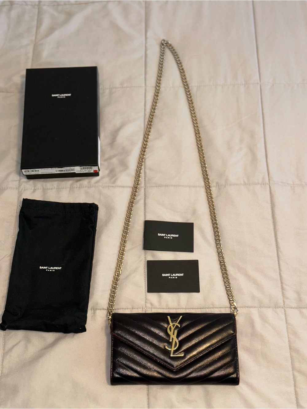 Saint Laurent clutch in a chain Black Quilted YSL Logo with Gold Hardware